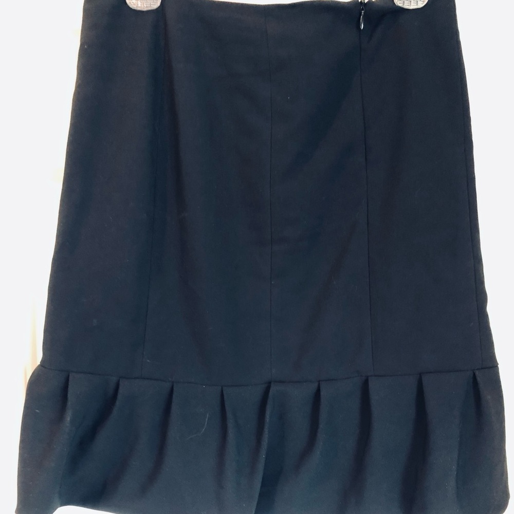 Black Ruffled Skirt above Knee